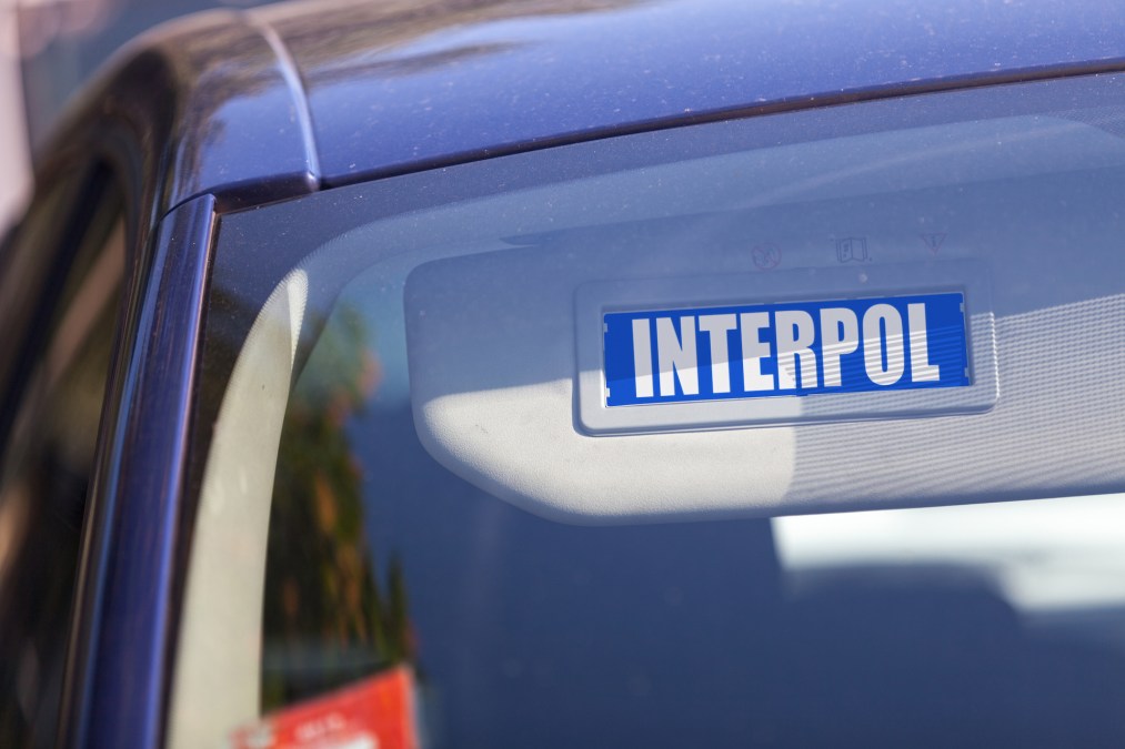 Blue sun visor with an Interpol sign.