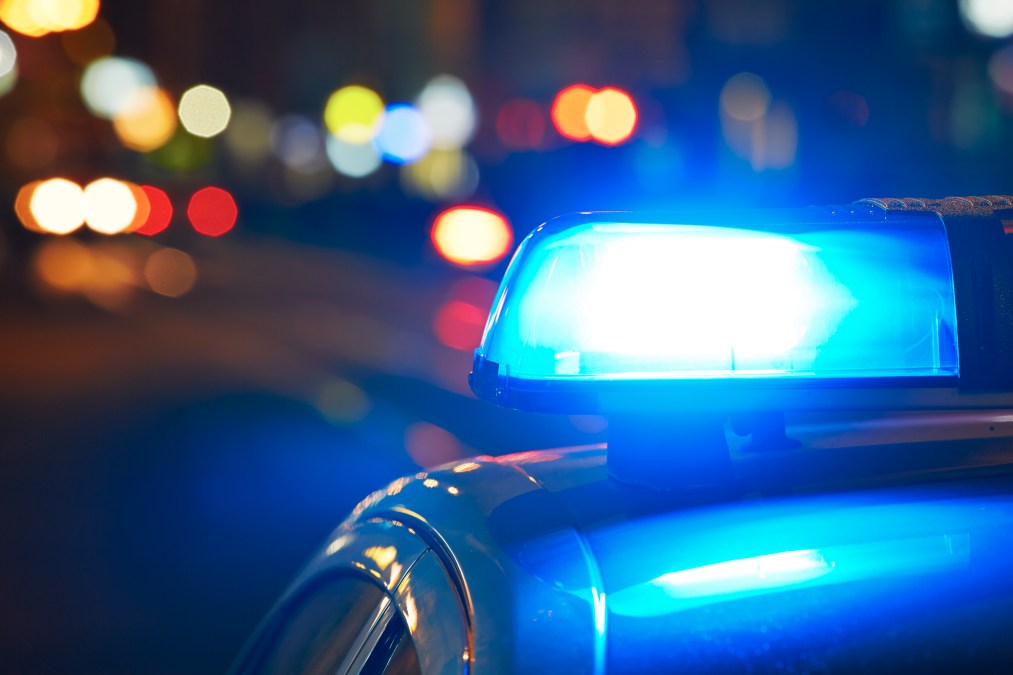 Police car on the street at night.