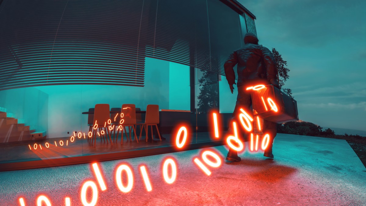 A trail of binary code emerges, representing the concept of a cybercrime. (Getty Images)