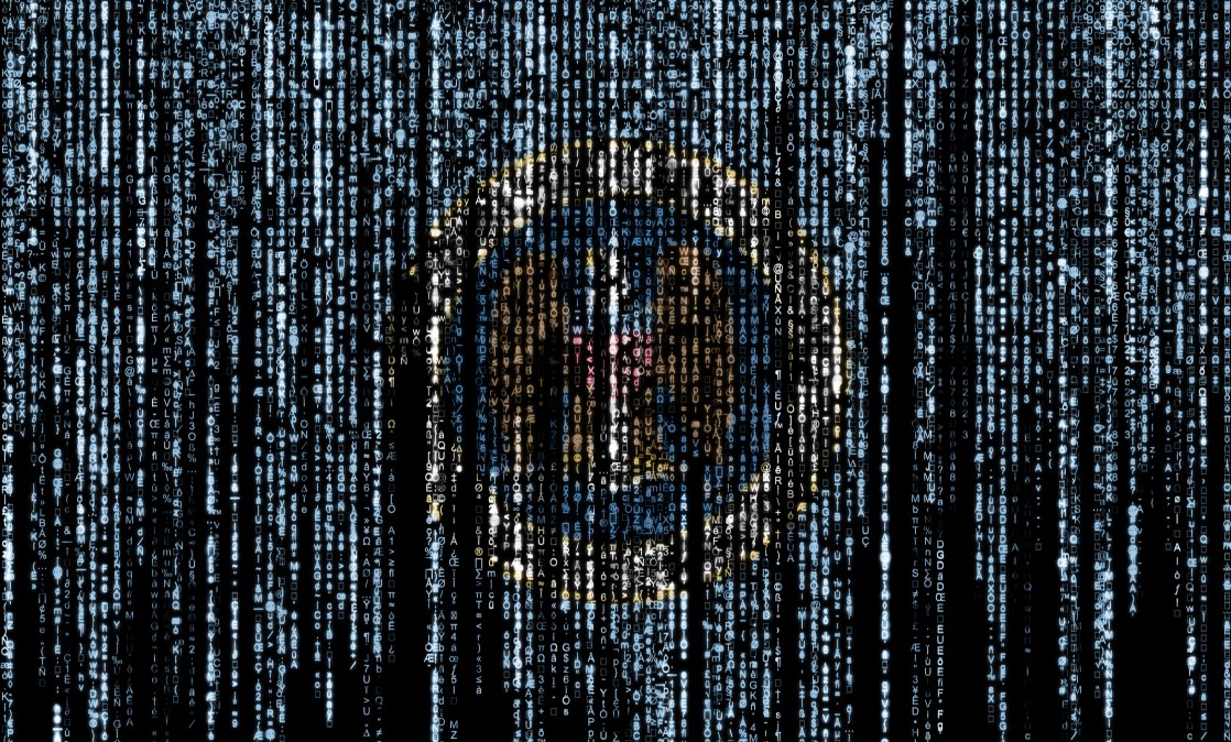 Flag of the National Security Agency on a computer binary codes falling from the top and fading away. (Getty Images)