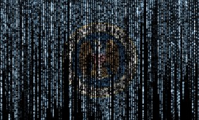 Flag of the National Security Agency on a computer binary codes falling from the top and fading away. (Getty Images)